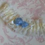 Ivory Bridal Garter With Blue Roses.