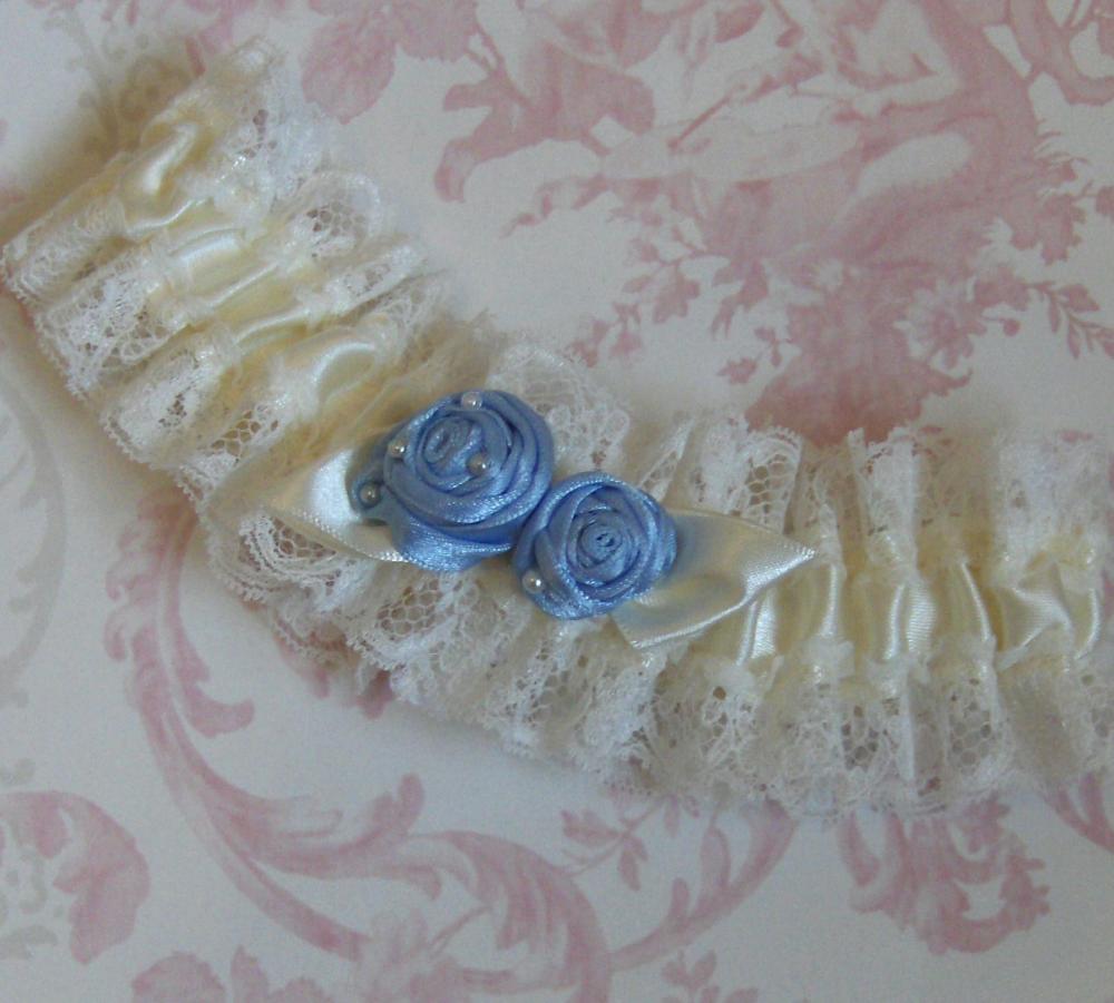 Ivory Bridal Garter With Blue Roses.
